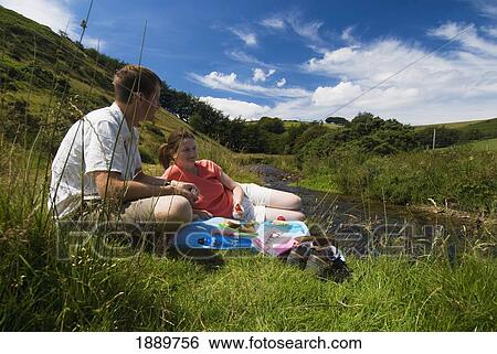 Couple Having Picnic Beside The River Exe View Large Photo Image Stock Photograph - Couple Having Picnic Beside The River Exe. Fotosearch