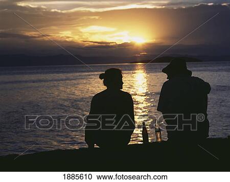 Couple Having Sundowner Drinks At Sunset On Domwe Island View Large Photo Image Stock Image - Couple Having Sundowner Drinks At Sunset On Domwe Island. Fotosearch