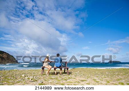 Couple In A Wild Beach In Mustique Island, St Vincent And The Grenadines, West Indies View Large Photo Image Stock Photo - Couple In A Wild Beach In Mustique Island, St Vincent And The Grenadines, West Indies. Fotosearch