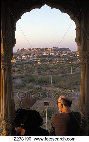 Couple in archway with view of city, Jaisalmer Fort; Jaisalmer, Rajasthan, India View Large Photo Image Stock Image - Couple in archway with view of city, Jaisalmer Fort; Jaisalmer, Rajasthan, India. Fotosearch