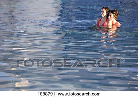 Stock Image - Couple In Swimming Pool.. Fotosearch