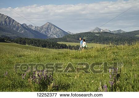 Couple in the Spanish Peaks mountain area, near Bozeman; Montana View Large Photo Image Stock Photo - Couple in the Spanish Peaks mountain area, near Bozeman; Montana. Fotosearch