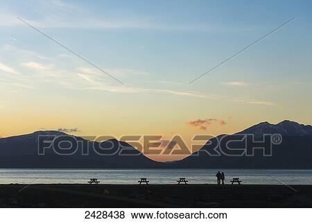 Couple looking across Loch Linnhe from the Hollytree Hotel; Kentallen, Argyll, Scotland View Large Photo Image Stock Photo - Couple looking across Loch Linnhe from the Hollytree Hotel; Kentallen, Argyll, Scotland. Fotosearch