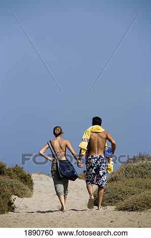 Stock Image - Couple On Beach. Fotosearch