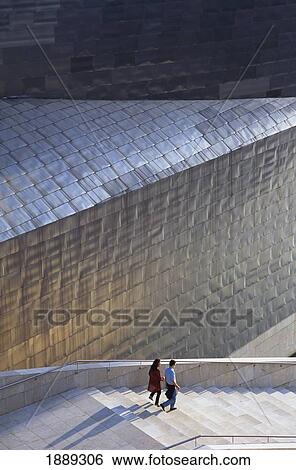 Stock Photograph - Couple On Steps Beside Guggenheim Art Museum. Fotosearch