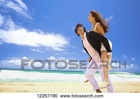 Couple on the beach; Kealia, Kauai, Hawaii, United States of America View Large Photo Image Stock Image - Couple on the beach; Kealia, Kauai, Hawaii, United States of America. Fotosearch