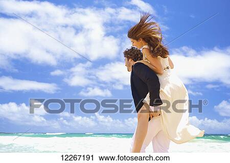 Couple on the beach; Kealia, Kauai, Hawaii, United States of America View Large Photo Image Stock Image - Couple on the beach; Kealia, Kauai, Hawaii, United States of America. Fotosearch