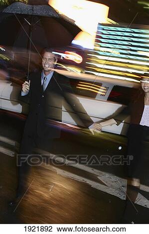 Stock Image - Couple Out At Night, Times Square. Fotosearch
