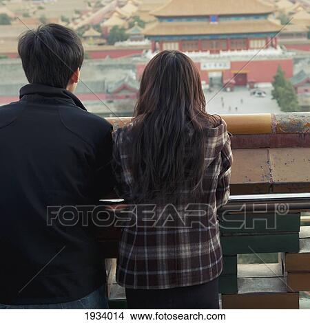 Couple Overlooking Forbidden City From Jingshan Park; Beijing, China View Large Photo Image Picture - Couple Overlooking Forbidden City From Jingshan Park; Beijing, China. Fotosearch