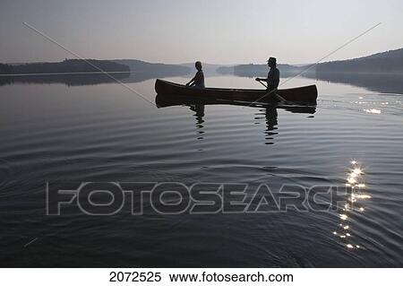 Couple Paddling At Dawn, Smoke Lake, Algonquin Park, Ontario View Large Photo Image Stock Photography - Couple Paddling At Dawn, Smoke Lake, Algonquin Park, Ontario. Fotosearch
