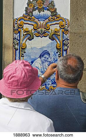 Stock Image - Couple Photographing A Quinta Panel At The Railway Station At Pinhao. Fotosearch