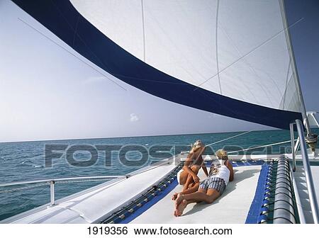 Couple Relaxing On Catamaran View Large Photo Image Stock Photograph - Couple Relaxing On Catamaran. Fotosearch