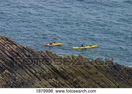 Couple Sea Kayaking Past Rocks Near Erquy View Large Photo Image Stock Photo - Couple Sea Kayaking Past Rocks Near Erquy. Fotosearch