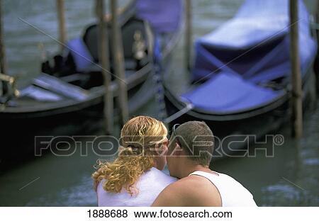Stock Photo - Couple Sitting Beside Grand Canal. Fotosearch
