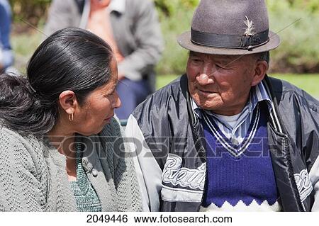 Stock Photograph - Couple Sitting On A Bench In Plaza Grande, Quito, Pichincha, Ecuador. Fotosearch