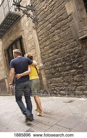 Couple Walking Arm In Arm Down Backstreet View Large Photo Image Stock Photograph - Couple Walking Arm In Arm Down Backstreet. Fotosearch