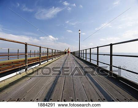 Couple Walking Down Pier View Large Photo Image Stock Image - Couple Walking Down Pier. Fotosearch