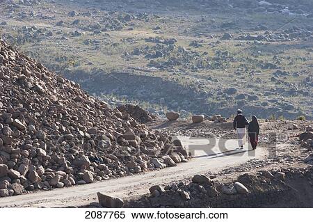 Couple Walking On A Road Damaged By The 8 October 2005 Earthquake, Sudhangali, Azad Kashmir, Pakistan View Large Photo Image Stock Photography - Couple Walking On A Road Damaged By The 8 October 2005 Earthquake, Sudhangali, Azad Kashmir, Pakistan. Fotosearch