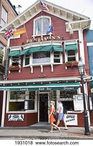 Couple Walking Past Benjamins, Famous For Lobster Roll, Bannister's Wharf, Newport, Rhode Island, Usa; Newport, Rhode Island, Usa View Large Photo Image Stock Photo - Couple Walking Past Benjamins, Famous For Lobster Roll, Bannister's Wharf, Newport, Rhode Island, Usa; Newport, Rhode Island, Usa. Fotosearch