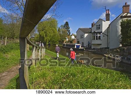 Picture - Couple Walking Their Dog On Riverbank Beside Shropshire Union Canal.. Fotosearch