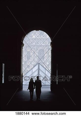 Couple Walking Through Passageway To The Pyramid Of The Louvre Museum View Large Photo Image Picture - Couple Walking Through Passageway To The Pyramid Of The Louvre Museum. Fotosearch