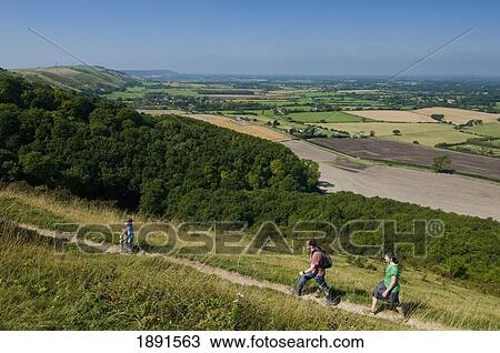 Couple With Boy Walking Along Path At Devil's Dyke Near Brighton View Large Photo Image Stock Image - Couple With Boy Walking Along Path At Devil's Dyke Near Brighton. Fotosearch