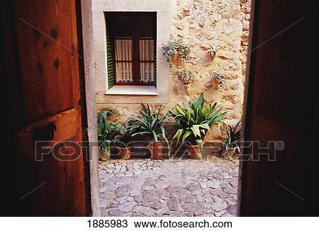 Courtyard And Plants Seen Through Doorway View Large Photo Image Stock Image - Courtyard And Plants Seen Through Doorway. Fotosearch