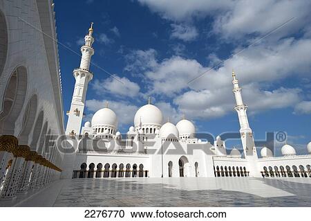 Stock Image - Courtyard of the Sheikh Zayed Grand Mosque; Abu Dhabi, United Arab Emirates. Fotosearch