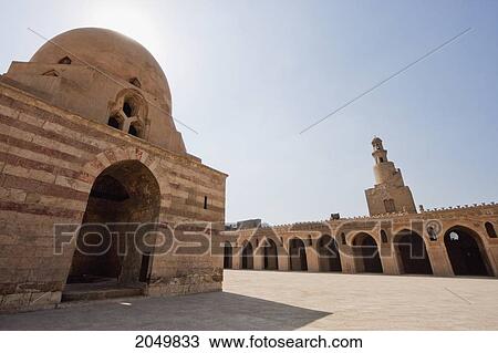 Stock Image - Courtyard With Domed Ablution Fountain Of And Spiral Minaret Of Ibn Tulun Mosque, Cairo, Al Qahirah, Egypt. Fotosearch
