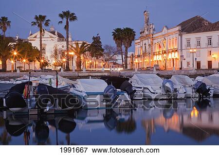 Stock Photo - Covered Boats In The Harbour At Dusk; Faro Algarve Portugal. Fotosearch