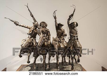 Stock Image - Cowboy Bronze Statue. Museum Of Texas Tech, Lubbock, Texas, Usa. Fotosearch