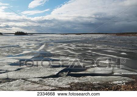 Stock Photo - Cracking Ice Cover On Lake; Finland. Fotosearch