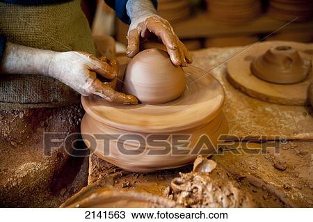 Stock Image - Craftsman Designing A Ceramic Piece, Alfareria Ferran Segarra, Miravet, Tarragona, Spain. Fotosearch