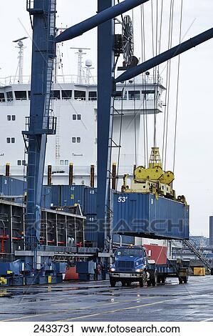 Crane and freight at Bickerdike Pier in Old Montreal; Montreal, Quebec, Canada View Large Photo Image Stock Image - Crane and freight at Bickerdike Pier in Old Montreal; Montreal, Quebec, Canada. Fotosearch
