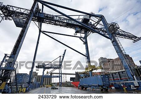 Stock Photo - Crane and freight at Bickerdike Pier in Old Montreal; Montreal, Quebec, Canada. Fotosearch