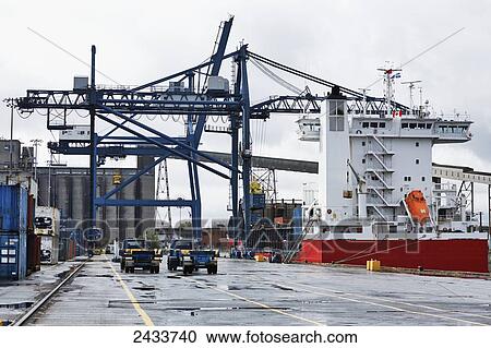 Crane and ship at Bickerdike Pier in Old Montreal; Montreal, Quebec, Canada View Large Photo Image Stock Image - Crane and ship at Bickerdike Pier in Old Montreal; Montreal, Quebec, Canada. Fotosearch