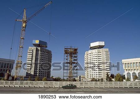 Stock Image - Crane On Construction Site Near Office Buildings. Fotosearch