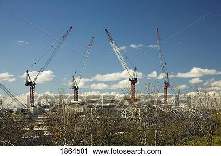 Stock Image - Cranes Building Soccer Arena, Melbourne, Australia. Fotosearch