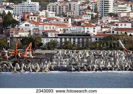Stock Image - Cranes Doing Construction At The Water's Edge To Prevent Water Erosion; Funchai, Madeira, Portugal. Fotosearch