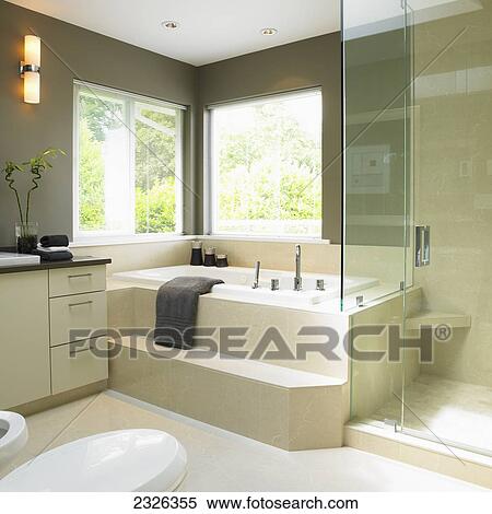 Stock Photography - Cream and taupe bathroom with soaker tub; Victoria vancouver island british columbia. Fotosearch