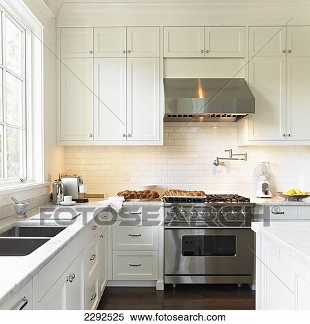 Cream kitchen with high-end viking stove and range hood; Victoria vancouver island british columbia canada View Large Photo Image Stock Photography - Cream kitchen with high-end viking stove and range hood; Victoria vancouver island british columbia canada. Fotosearch