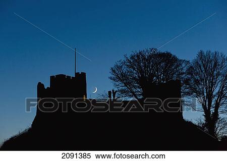 Crescent Moon Setting Behind Silhouette Of Lewes Castle, Lewes, East Sussex, Uk View Large Photo Image Stock Photography - Crescent Moon Setting Behind Silhouette Of Lewes Castle, Lewes, East Sussex, Uk. Fotosearch