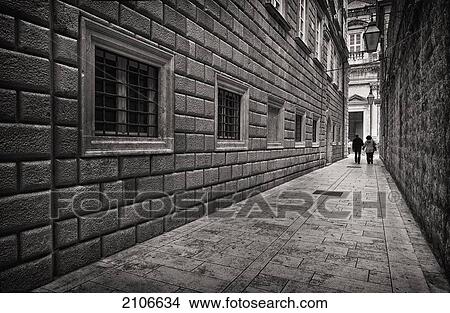 Croatia, Couple walking down small alley in old town; Dubrovnik View Large Photo Image Picture - Croatia, Couple walking down small alley in old town; Dubrovnik. Fotosearch
