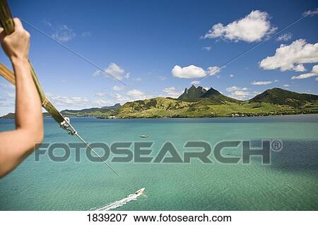 Cropped View Of Person Parasailing With View Of Lion Mountain; Mauritius View Large Photo Image Stock Photo - Cropped View Of Person Parasailing With View Of Lion Mountain; Mauritius. Fotosearch