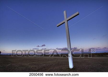 Stock Photograph - Cross And Cemetery At Sunset, Fedora, Alberta. Fotosearch