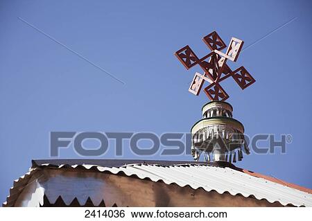Stock Photograph - Cross on top of modern church building, beside Abreha wa Atsbeha church; Gheralta, Tigray region, Ethiopia. Fotosearch