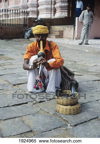 Crouching Snake Charmer View Large Photo Image Stock Photography - Crouching Snake Charmer. Fotosearch