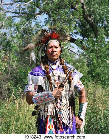 Stock Image - Crow Indian Waiting For The Pow-Wow. Fotosearch