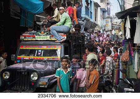 Stock Photograph - Crowd Among Truck On Street; Pushkar, India. Fotosearch