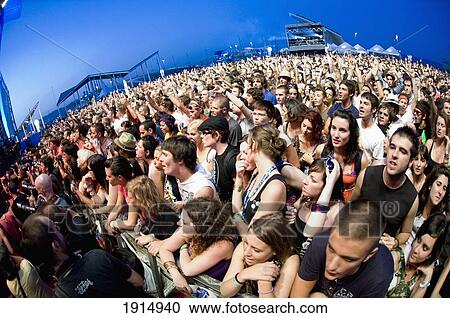 Stock Image - Crowd Attending Summer Festival. Fotosearch